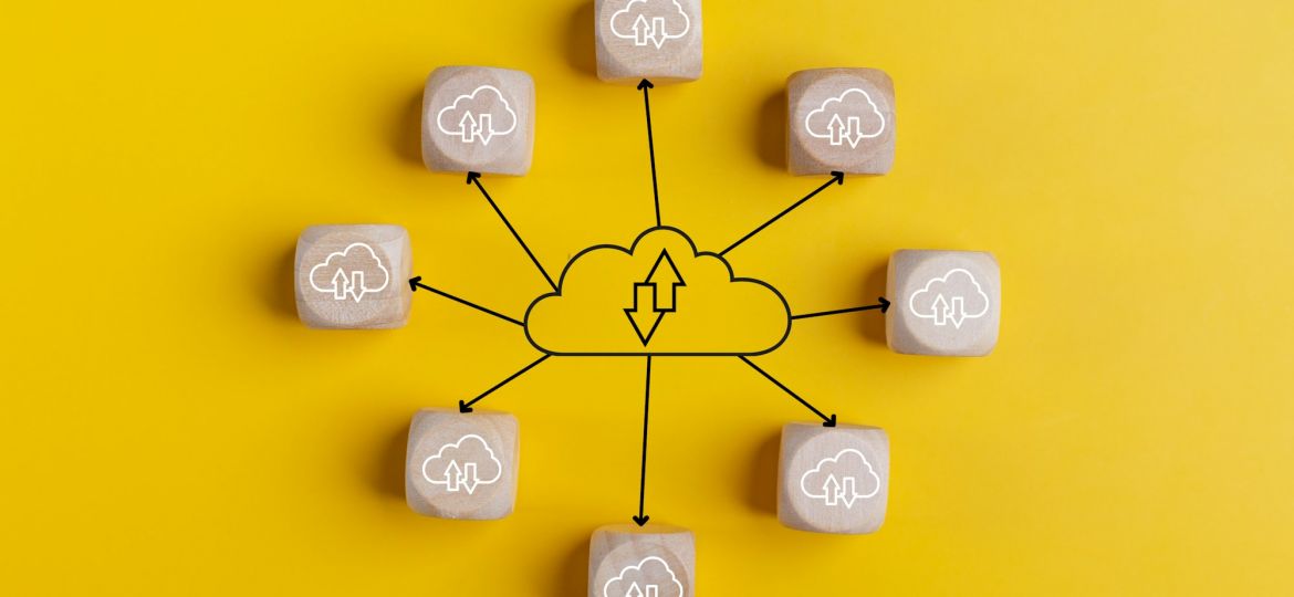Cloud computing concept with wooden cubes on a yellow background. Top view. Cloud technology.